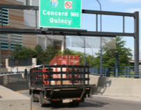 picture of small flatbed truck with fence rail sides